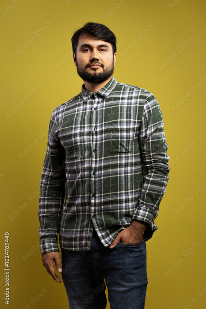 serious man, with one hand in his pants pocket and the other loose serious man, with one hand in his pants pocket and the other loose