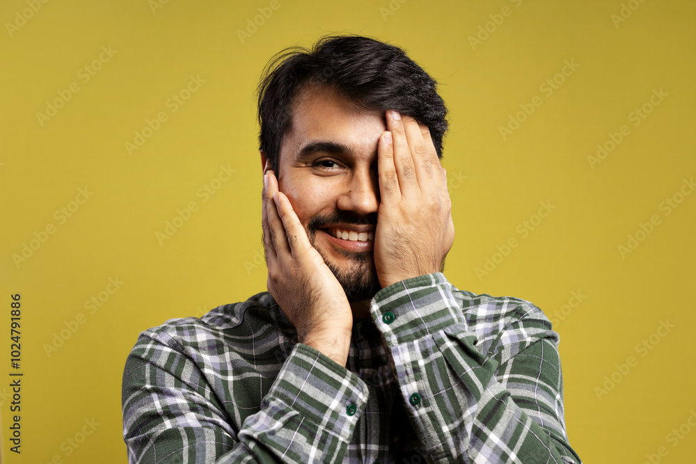 man smiling with hands touching face man smiling with hands touching face