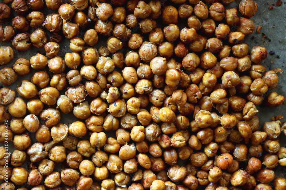 Sheet pan with homemade roasted chickpeas. Top view. Sheet pan with homemade roasted chickpeas. Top view.