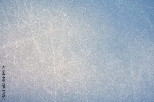 An ice surface as an ice rink with ice skates tracks. Winter sports texture. photo