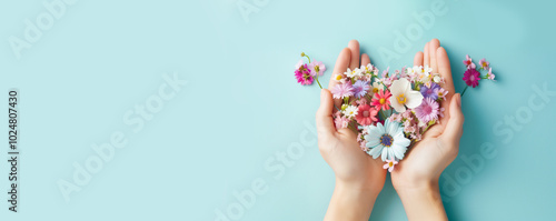 Heart with flowers, love and emotion concept, good hearted person, help and charity, mother day 