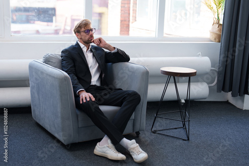 A man in office listening his employees about work.