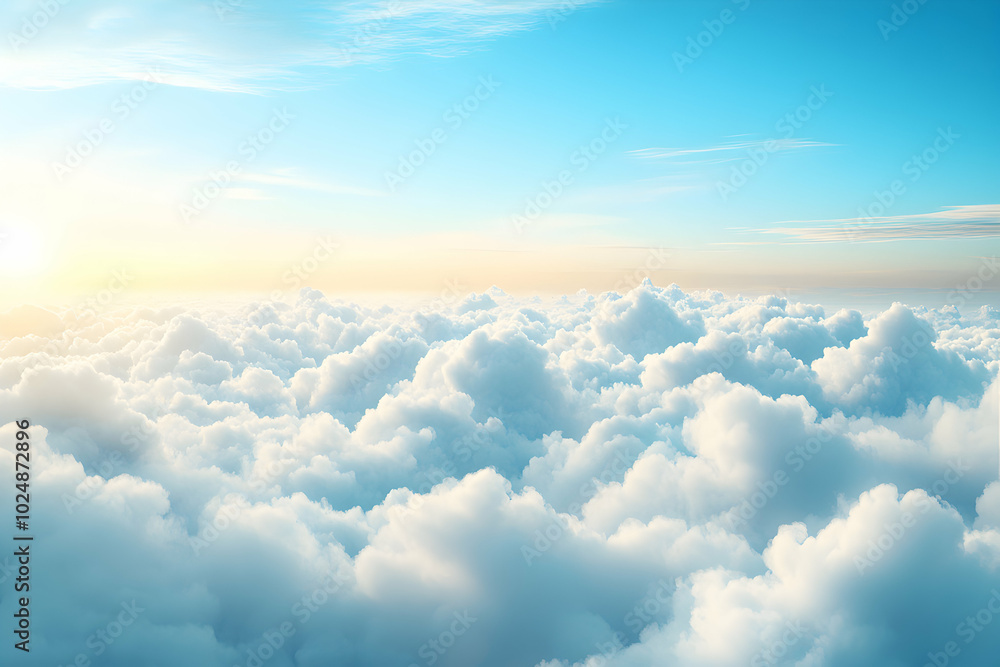 A panoramic view of fluffy white clouds with a bright blue sky and golden sunlight above. A panoramic view of fluffy white clouds with a bright blue sky and golden sunlight above.