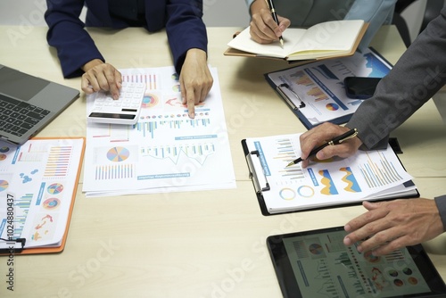 Group of business people discussing work and agreeing to work together. Business people discussing projects in office using laptops. Business people shaking hands in conference room. Video.