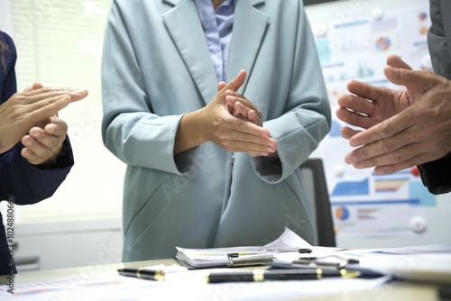 Group of business people discussing work and agreeing to work together. Business people discussing projects in office using laptops. Business people shaking hands in conference room. Video.