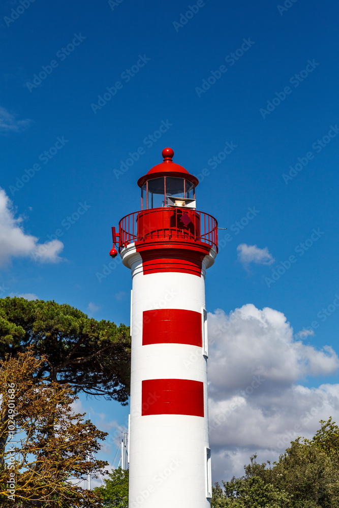 Red and white striped iron lighthouse in La Rochelle, Charente-Maritime, France, Europe Red and white striped iron lighthouse in La Rochelle, Charente-Maritime, France, Europe