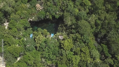 Orbit Aerial view of Cenote Nicte Ha in Dos Ojos Park, Tulum, Mexican Caribbean