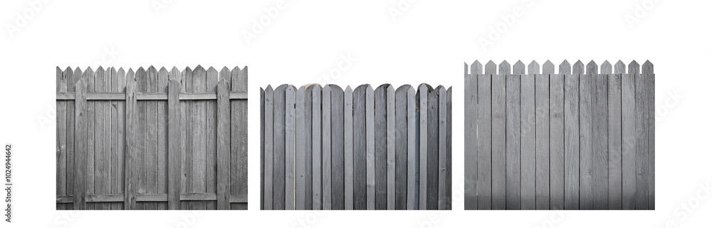 A close up of a wooden fence with pointed picket tops. A close up of a wooden fence with pointed picket tops.