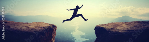 Silhouette man jumping over cliffs for I can do it, good mindset, freedom, good mindset, photo, poster, conceptual art, success, goals 