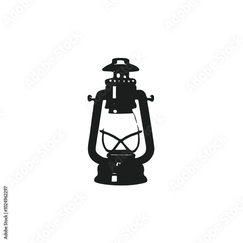 An old-fashioned black and white oil lamp with a glass shade and a metal frame 