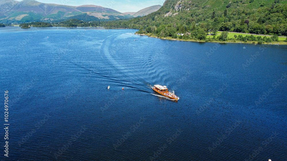 Fototapeta premium Aerial view of a boat sailing on a lake, United Kingdom