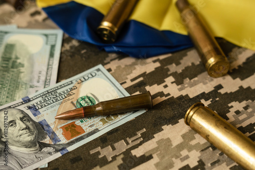 The cartridge from the pistol lies on American dollars. The concept of arms sales.