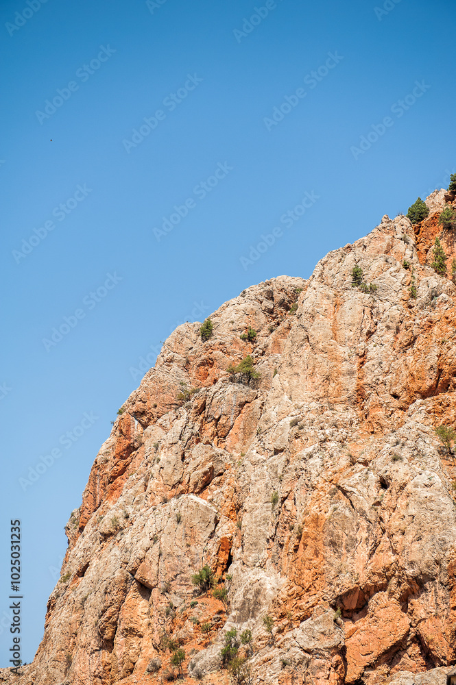 Scenic view of natural red rock cliffs formations Scenic view of natural red rock cliffs formations