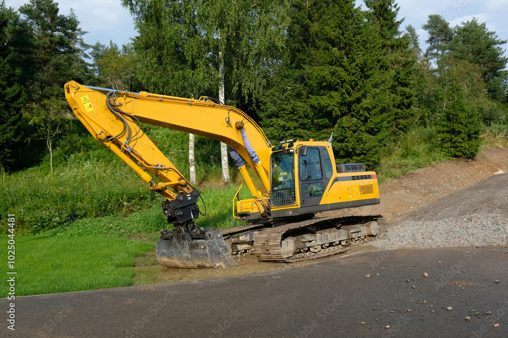 yellow excavator on the road yellow excavator on the road