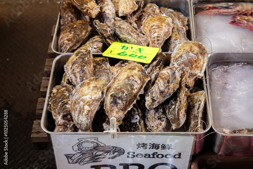 Fototapeta Naklejka Na Ścianę i Meble -  Oyster for sale at Japanese street Market Tokyo Japan 2024 