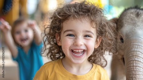 Joyful Child with Baby Elephant at Playful Setting