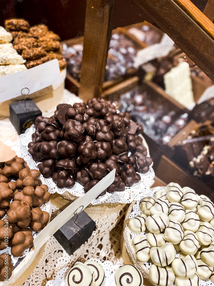 Shelves with candies and chocolates in a craft sweet shop. Sweets and chocolate concept Shelves with candies and chocolates in a craft sweet shop. Sweets and chocolate concept
