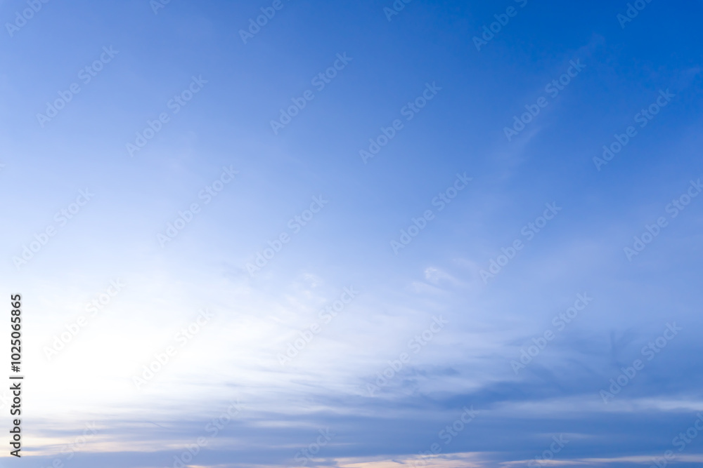 Obraz premium Beautiful morning or evening blue and orange sky while sunsets or sunrises taken at the sea used as natural blackground texture.