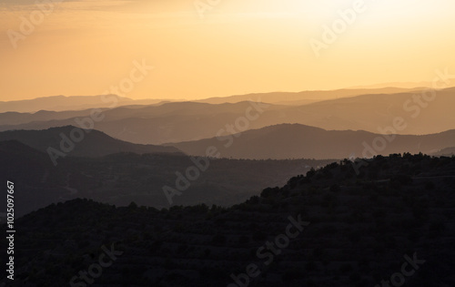 Beautiful sunset in the mountains. Mountain layers. Orange sky. Near Stavrovouni Monastery in Cyprus