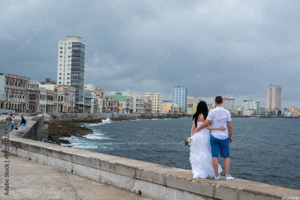 female hand with cuban cigar, woman, cuban cigar day, cuban flag, manicure, cuban flag on nail, couple sitting in car by turquoise ocean, trip to cuba, honeymoon female hand with cuban cigar, woman, cuban cigar day, cuban flag, manicure, cuban flag on nail, couple sitting in car by turquoise ocean, trip to cuba, honeymoon