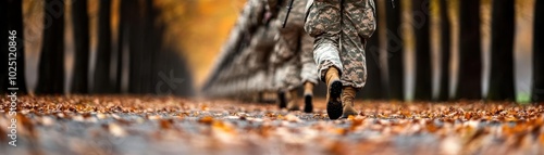 Wallpaper Mural A soldier walks through a forest path covered in autumn leaves, symbolizing courage and serenity in nature's beauty. Torontodigital.ca