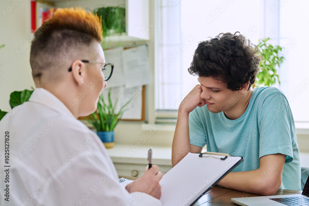 College student guy at meeting with professional counselor, social worker College student guy at meeting with professional counselor, social worker