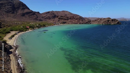 Wallpaper Mural Aerial drone footage of a clear water bay with coral reef surrounded by desert and rocky cliffs on a clear summer day Torontodigital.ca