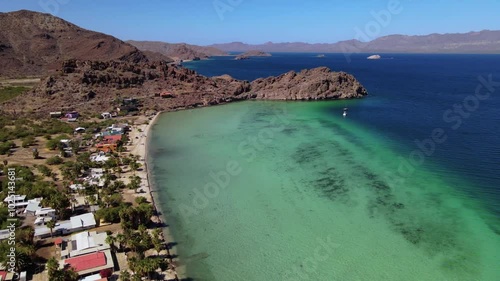 Wallpaper Mural Aerial drone footage of a clear water bay with coral reef surrounded by desert and rocky cliffs on a clear summer day Torontodigital.ca