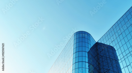 Modern Building with Curved Glass Facade Reflecting Sky – Contemporary Architectural Design, Sleek Glass Exterior, and Minimalist Urban Skyscraper