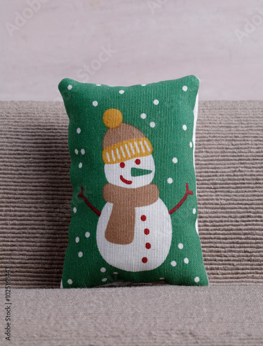 Cushion with snowman on sofa photo