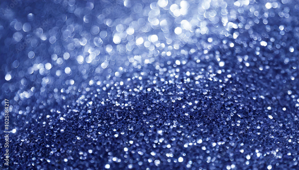 Dazzling blue bokeh effect created by shimmering droplets on a surface illuminated in soft light Dazzling blue bokeh effect created by shimmering droplets on a surface illuminated in soft light