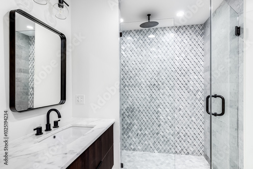 A bathroom detail with a floating wood cabinet vanity, white marble countertop, and a walk-in mosaic marble tile shower. No brands or labels. photo