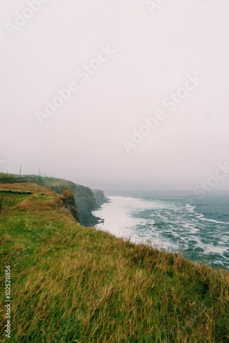 Misty Cliffs and Crashing Waves on Terceira Island's Coastline