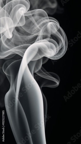 Abstract paranormal misty smoke against an isolated black backdrop textured with overlay effects to create eerie cloud-like forms for movie scene imagery