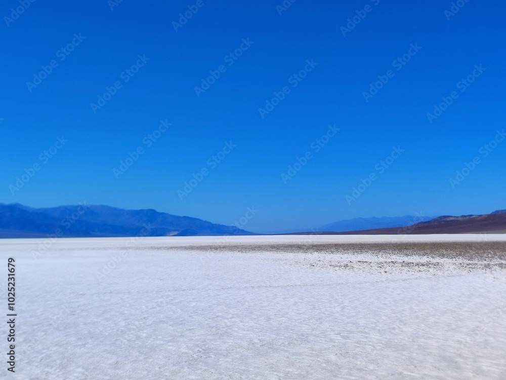 death valley landscape, salt lake view, panorama, people silhouette in the distance death valley landscape, salt lake view, panorama, people silhouette in the distance