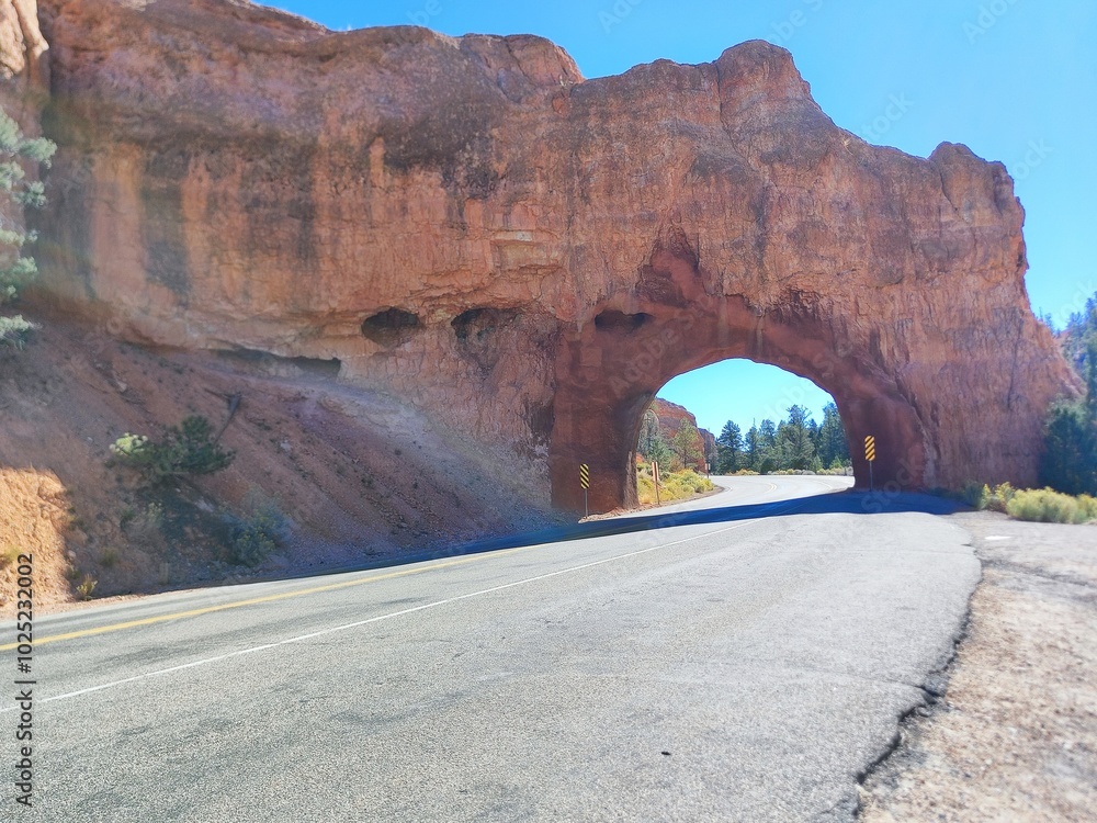 Bryce canyon road passing throw a rock formation hole, nobody, no cars Bryce canyon road passing throw a rock formation hole, nobody, no cars