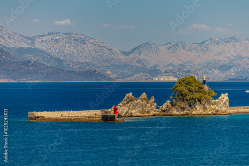 The port of Trpanja and the statue of Our Lady Star of the Sea photo