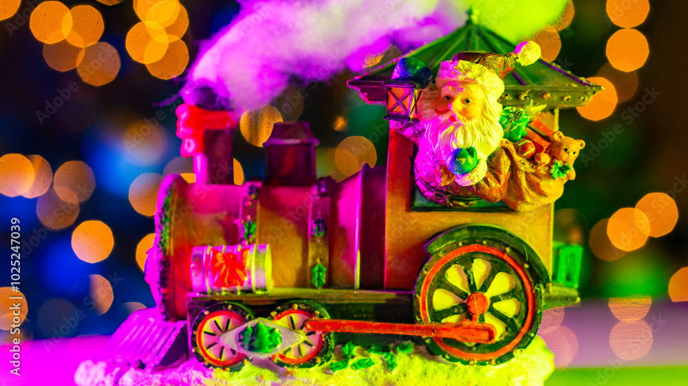 Obraz premium Santa Claus in Christmas Train. Shipping the New year gift. Christmas Polar Train with Christmas decorations. Santa delivery gift through. The train pulls Santa Claus near Christmas tree.