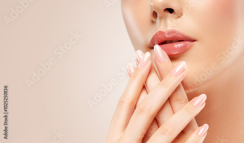 Beautiful girl hand care . Model woman showing french shellac manicure on nails . Cosmetics ,beauty and makeup