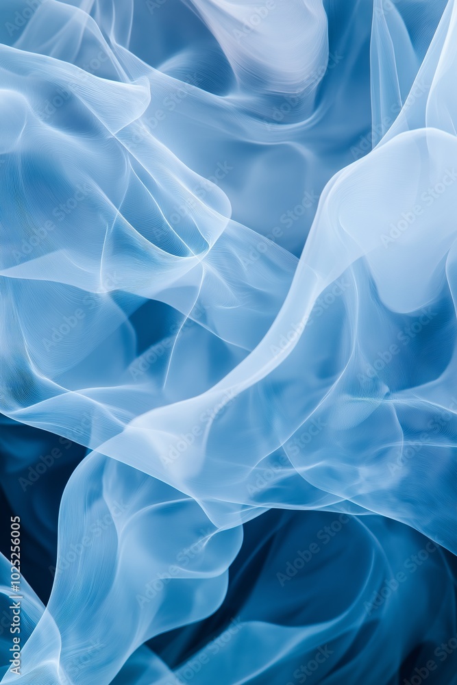 Obraz premium A blue and white image of a fabric with a blue flame. The image has a dreamy, ethereal quality to it, with the blue and white colors blending together to create a sense of movement and fluidity