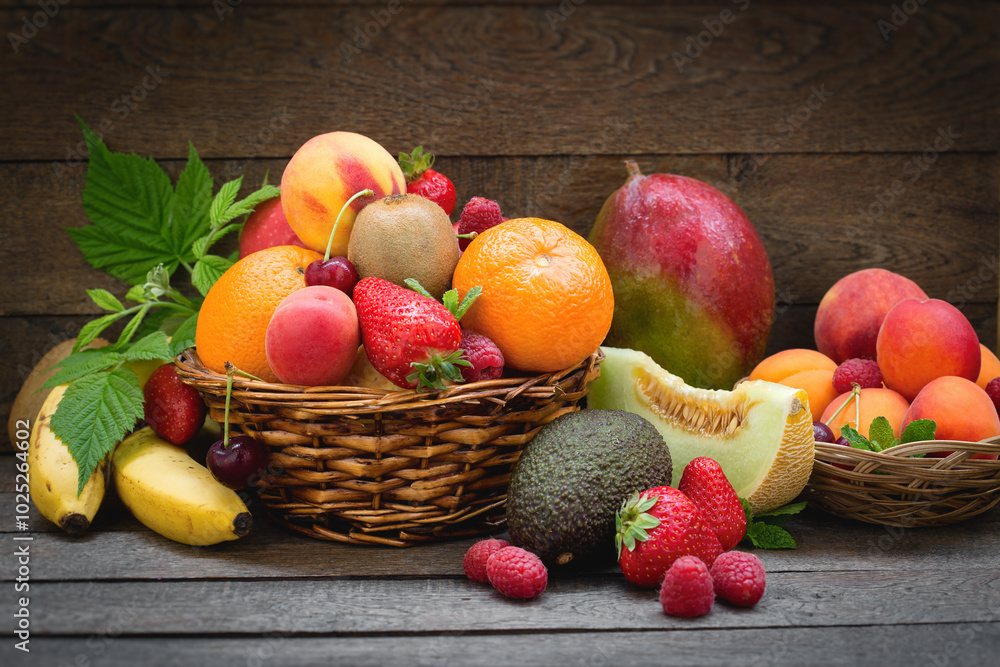 Bunch of juicy delicious organic fruits in basket on table Bunch of juicy delicious organic fruits in basket on table
