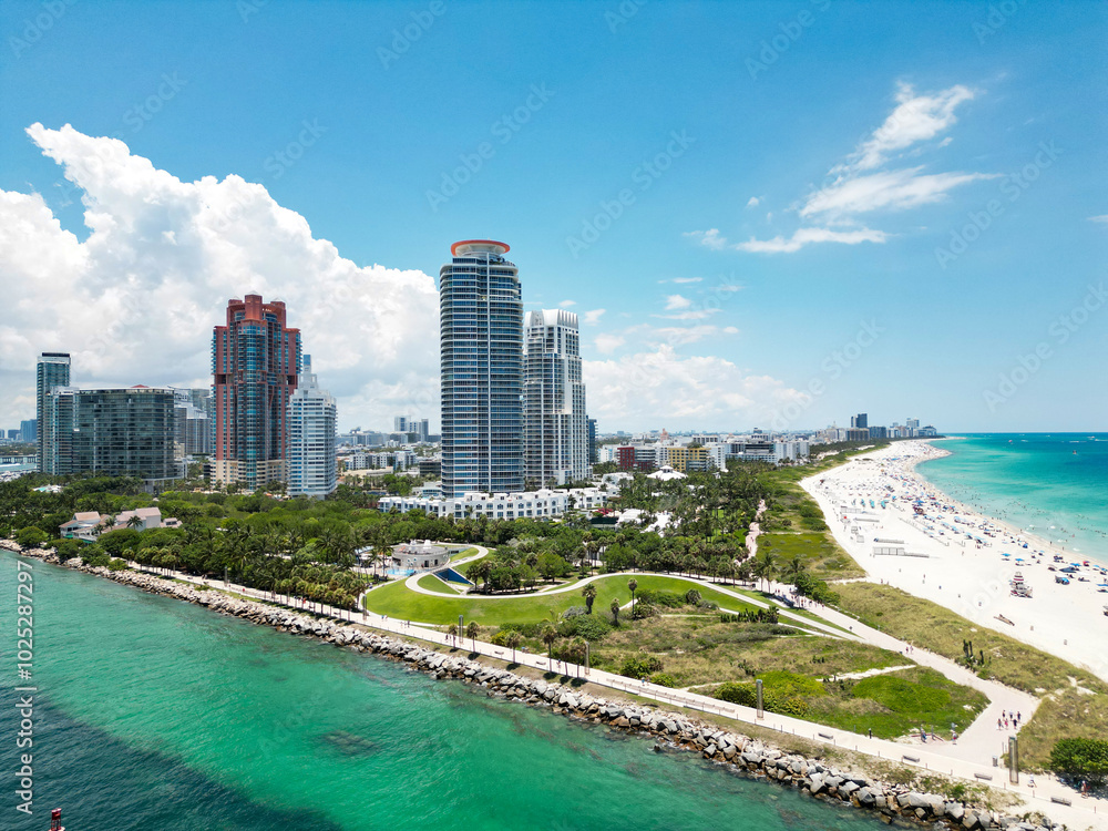 Fototapeta premium Miami beach, ocean drive summer cityscape. Miami Beach, South Beach, Florida, USA. Coastline, aerial view. Aerial view of high skyscrapers and ocean, Miami Beach, Florida, United States.