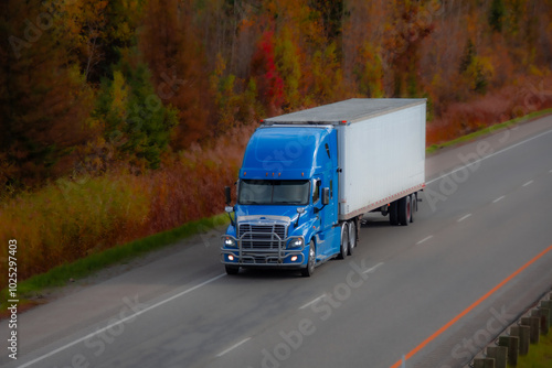 Heavy truck on a Canadian highway in the fall in Quebec