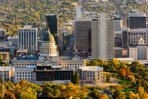 Utah State Capitol and Salt Lake City skyline on a sunny afternoon. Salt Lake City, is the capital and most populous city of the U.S. state of Utah