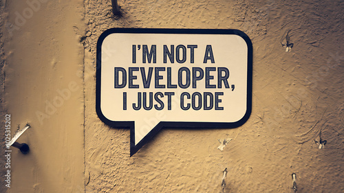 Black and white speech bubble on a yellow wall, a humorous and relatable message about coding. 
 photo