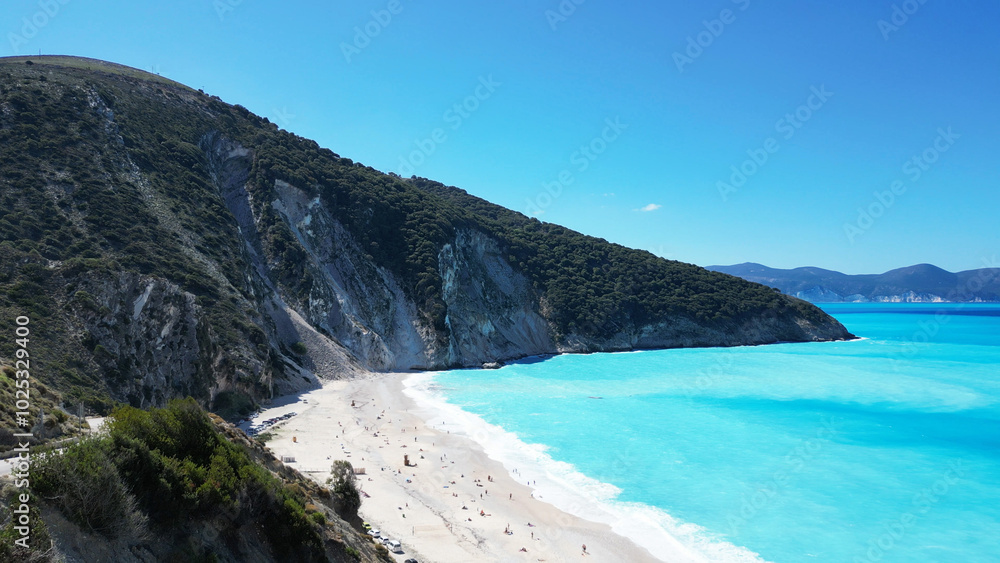 Breathtaking Stunning Beach View Featuring Crystal Clear Water and Scenic, Lush Green Hills Breathtaking Stunning Beach View Featuring Crystal Clear Water and Scenic, Lush Green Hills
