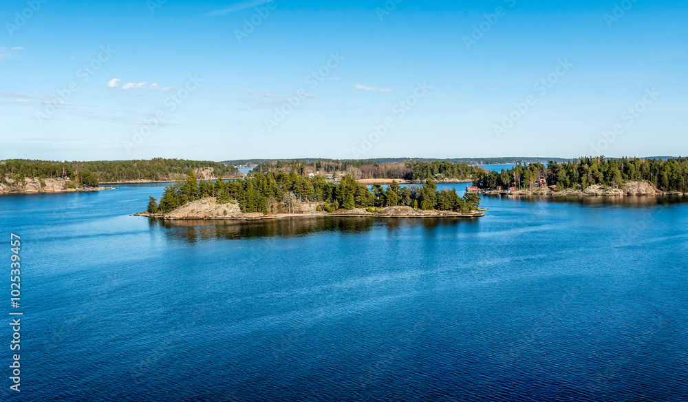 Rocky coast of Stockholm archipelago in Baltic sea with traditional houses at sunny spring evening scenery. Rocky coast of Stockholm archipelago in Baltic sea with traditional houses at sunny spring evening scenery.