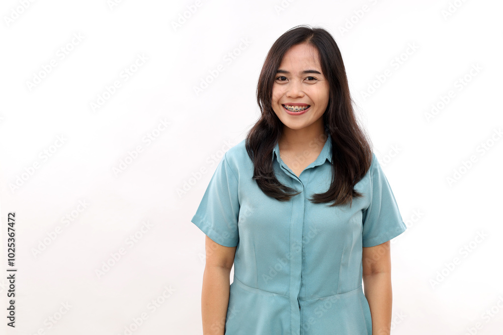 Asian worker smiles gently at the camera, satisfied after a successful day at the office. Isolated on white Asian worker smiles gently at the camera, satisfied after a successful day at the office. Isolated on white
