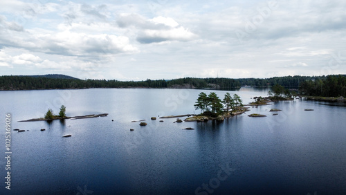 Aerial view of a serene Swedish lake with tiny Islands