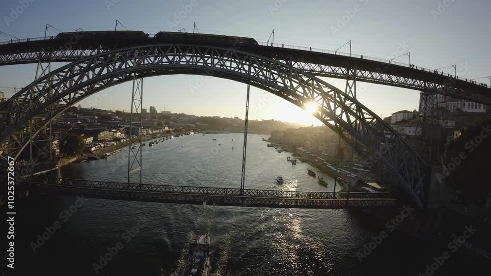 Flying over the Douro River at sunset with a view of the Luis Bridge. Landmark of Portugal. Flying over the Douro River at sunset with a view of the Luis Bridge. Landmark of Portugal.
